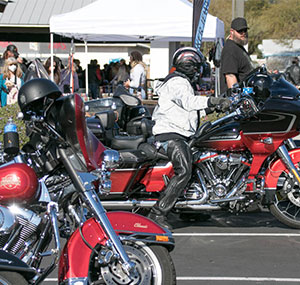 Harley riders riding out of superstition harley-davidson on wild horse ride